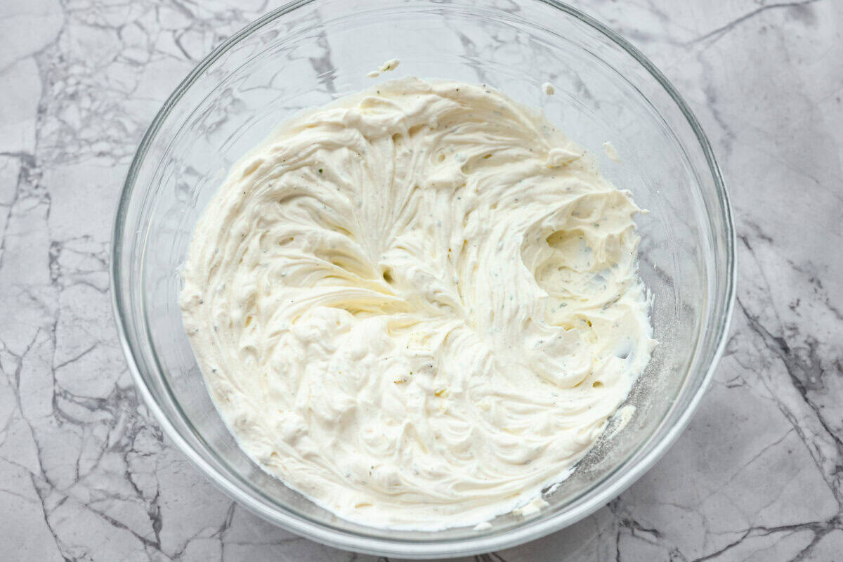 Creamy, cheesy, and loaded with crack dip flavor! This 6-ingredient appetizer is served cold and ready in just 10 minutes. Good luck keeping it on the table. Cream cheese, sour cream, and ranch dressing mix all whipped together in a bowl.